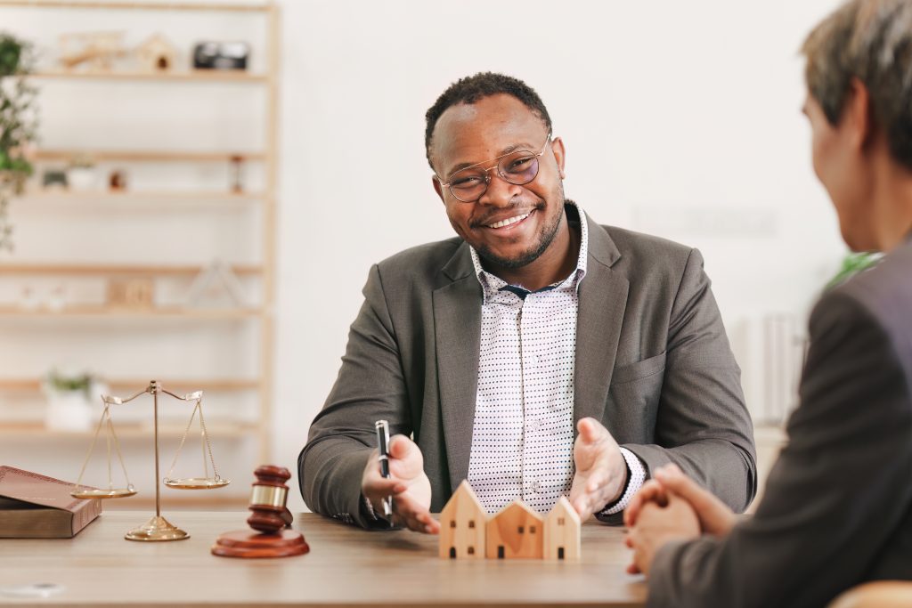 Image: a property manager looking at the camera.